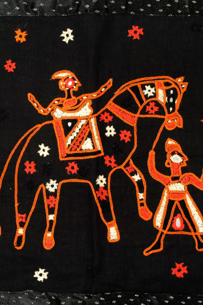 black Gujarati toran door hanging with orange embroidery - close up
