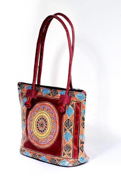 sun motif Shantiniketan leather handbag - side view
